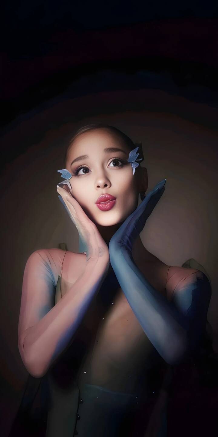 Download this Ariana Grande 4K wallpaper for your iPhone! This wallpaper features Ariana with butterfly clips, pink lipstick, and blue gloves. | singer iphone mobile butterfly ariana grande celebrity 4k wallpaper hd wallpaper actress pop star ariana grande ethereal Download this Ariana Grande 4K wallpaper for your iPhone! This wallpaper features Ariana with butterfly clips, pink lipstick, and blue gloves.