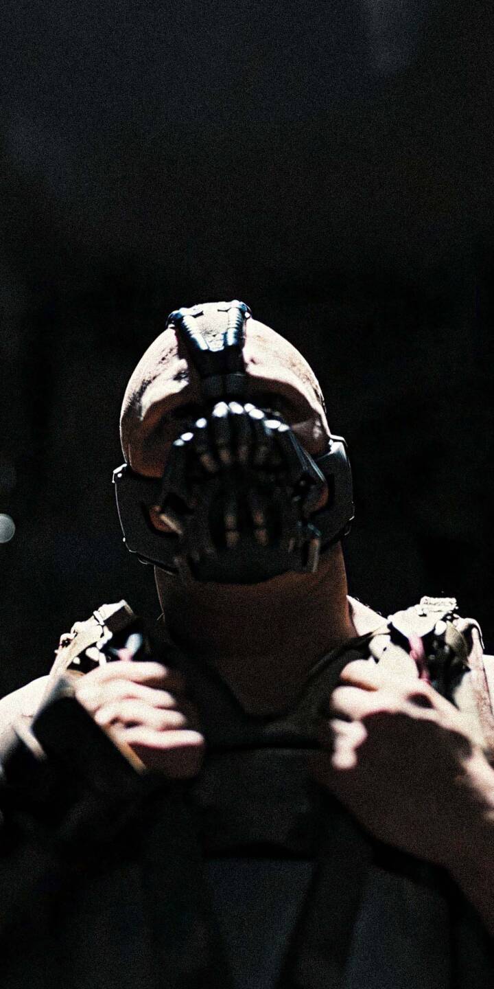Download this amazing Bane 4K wallpaper for your iPhone, showing his iconic mask and muscular physique. This wallpaper captures the intimidating presence of the Batman villain. | portrait batman mask iphone villain Tom Hardy mobile antagonist 4k wallpaper hd wallpaper menacing tactical dark atmosphere gotham city villain aesthetic bane bane wallpaper the dark knight rises league of shadows gritty texture cinematic close-up hyper-realistic DC Villains movie stills dc comics Download this amazing Bane 4K wallpaper for your iPhone, showing his iconic mask and muscular physique. This wallpaper captures the intimidating presence of the Batman villain.
