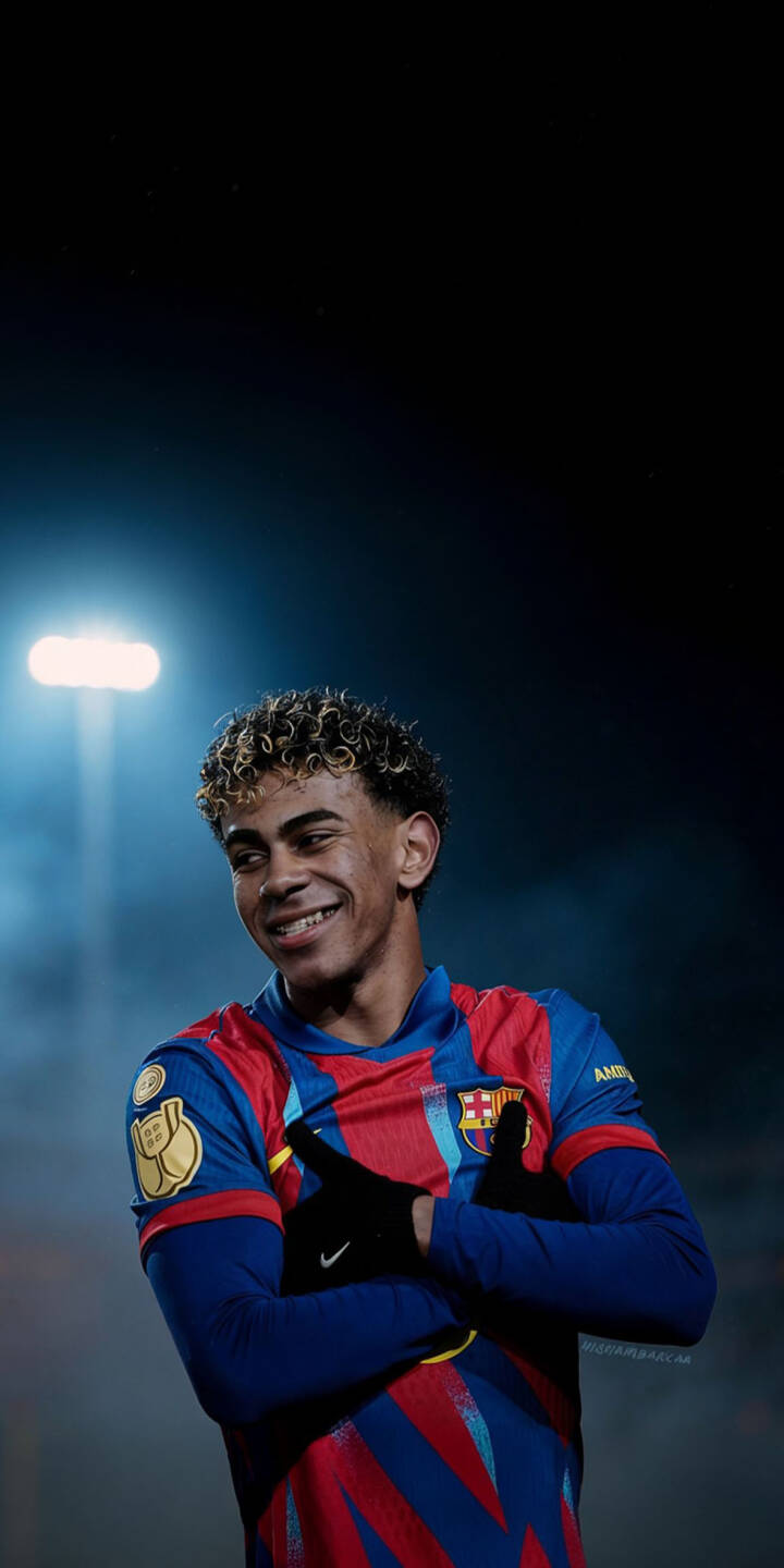 Download this Lamine Yamal 4K wallpaper for your iPhone! The wallpaper features Yamal in a blue and red FC Barcelona jersey with the FCB emblem, black gloves, and a confident smile. | football iphone soccer barcelona yamal lamine yamal soccer player fc barcelona mobile 4k wallpaper hd wallpaper laliga Download this Lamine Yamal 4K wallpaper for your iPhone! The wallpaper features Yamal in a blue and red FC Barcelona jersey with the FCB emblem, black gloves, and a confident smile.