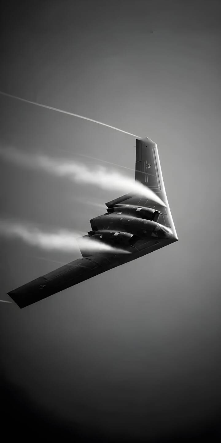Download this stunning B-2 Spirit wallpaper for your iPhone, showcasing the stealth bomber in 4K. The B-2 leaves ghostly vapor trails as it soars through the sky with its distinctive, angular silhouette. | iphone airplane mobile aircraft 4k wallpaper hd wallpaper monochrome aviation military aircraft stealth bomber b-2 spirit vapor trails Download this stunning B-2 Spirit wallpaper for your iPhone, showcasing the stealth bomber in 4K. The B-2 leaves ghostly vapor trails as it soars through the sky with its distinctive, angular silhouette.