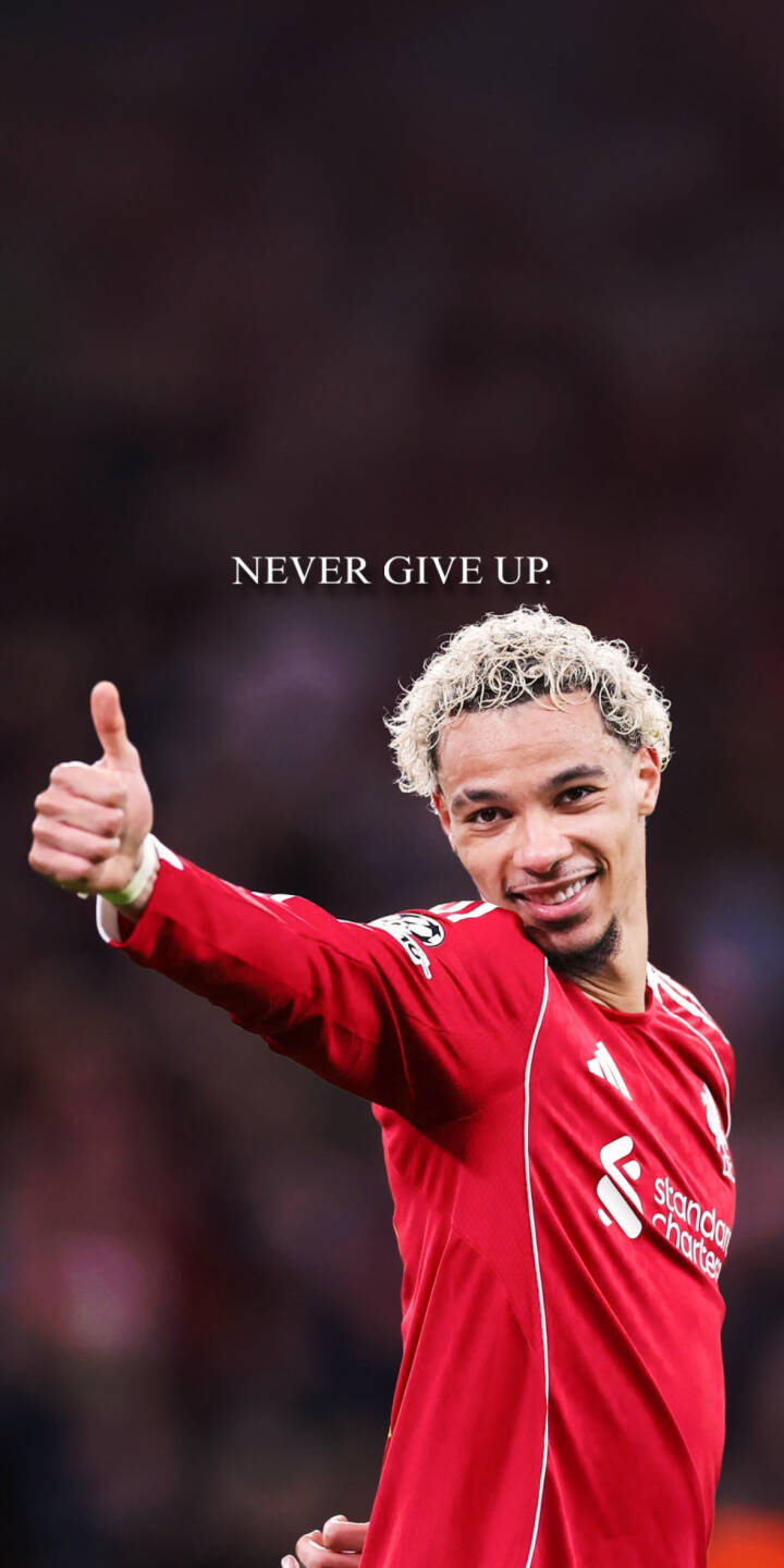 Download this ekitike 4K wallpaper for your iPhone, showcasing him in his red Liverpool jersey. The wallpaper features Gakpo giving a thumbs up with a motivational message of “Never Give Up”. | football iphone soccer premier league liverpool mobile never give up 4k wallpaper hd wallpaper gakpo anfield ekitike Download this ekitike 4K wallpaper for your iPhone, showcasing him in his red Liverpool jersey. The wallpaper features Gakpo giving a thumbs up with a motivational message of “Never Give Up”.