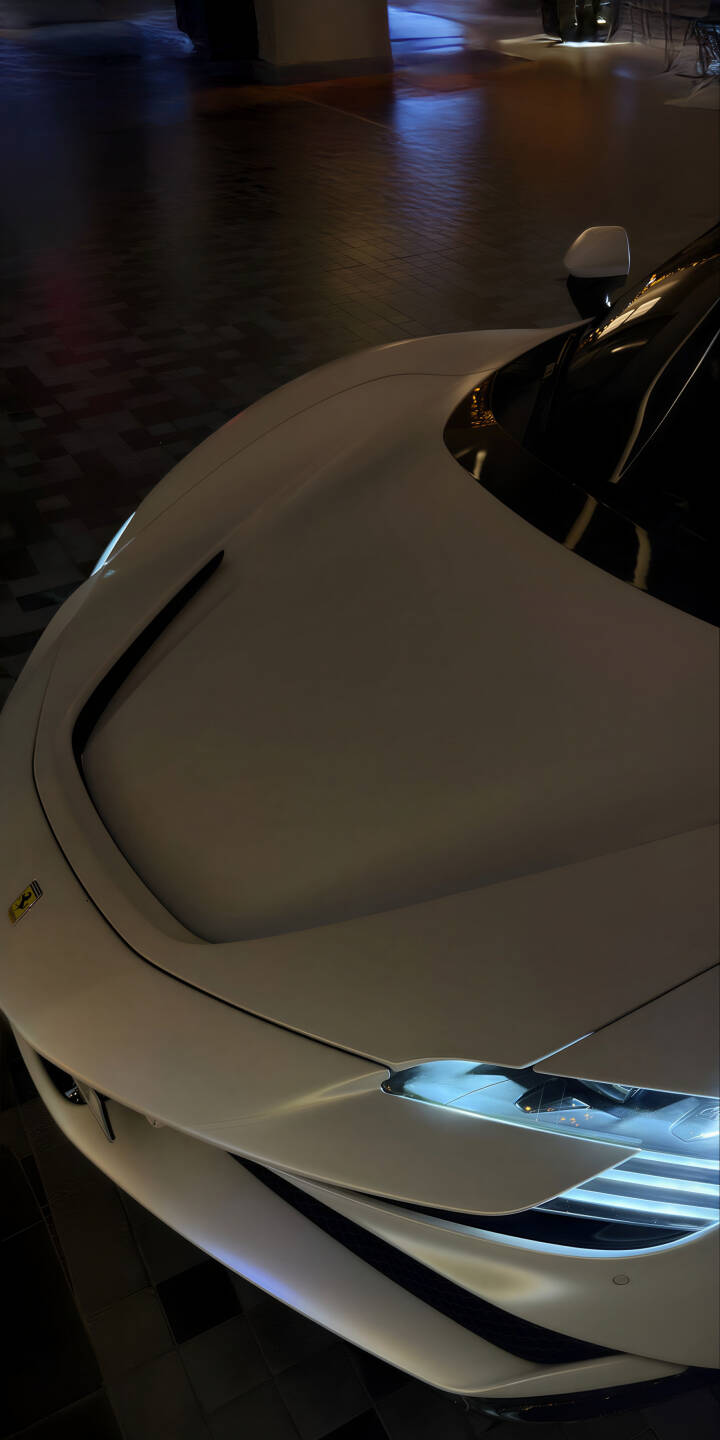 Elevate your iPhone screen with this stunning Ferrari SF90 Stradale 4K wallpaper, showcasing its sleek white bodywork, bright LED headlights, and prominent hood vents in a captivating low-light setting. This premium wallpaper perfectly captures the essence of this high-performance supercar. | sports car iphone ferrari supercar mobile luxury car white car 4k wallpaper hd wallpaper automotive car wallpaper ferrari sf90 stradale Elevate your iPhone screen with this stunning Ferrari SF90 Stradale 4K wallpaper, showcasing its sleek white bodywork, bright LED headlights, and prominent hood vents in a captivating low-light setting. This premium wallpaper perfectly captures the essence of this high-performance supercar.
