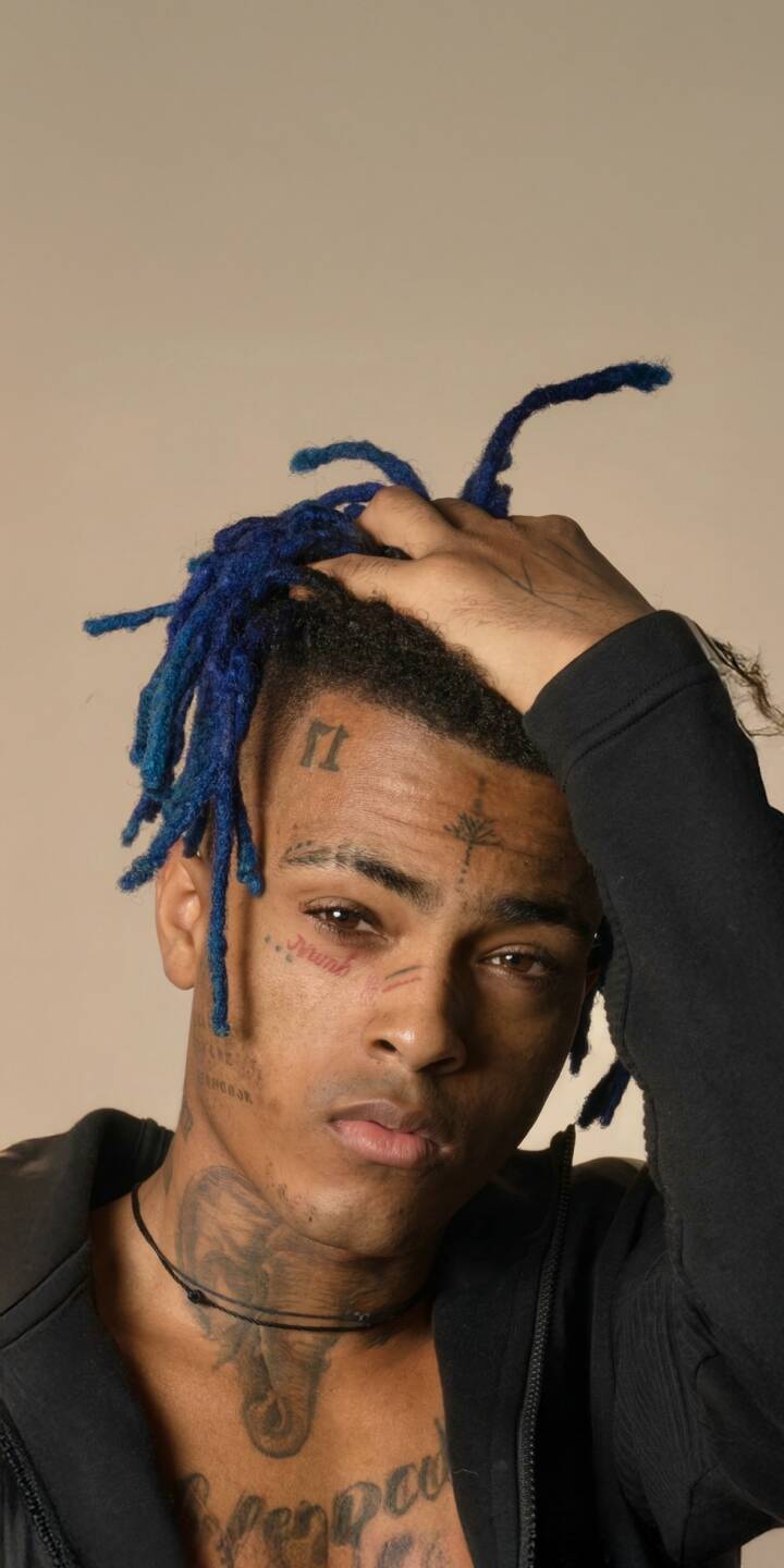 Elevate your iPhone screen with this striking XXXTentacion 4K wallpaper, featuring his iconic blue dreadlocks and distinctive face tattoos. This high-quality wallpaper captures him with a hand in his hair, providing a powerful and personal backdrop for your device. | rapper music portrait xxxtentacion iphone x mobile 4k wallpaper hd wallpaper blue dreads memorial facetats Elevate your iPhone screen with this striking XXXTentacion 4K wallpaper, featuring his iconic blue dreadlocks and distinctive face tattoos. This high-quality wallpaper captures him with a hand in his hair, providing a powerful and personal backdrop for your device.