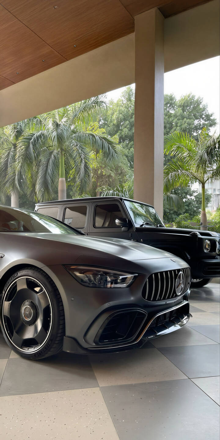 Elevate your iPhone with this stunning 4K Mercedes-AMG GT and G-Wagen wallpaper, showcasing the sleek matte grey finish of the AMG GT, its distinctive grille, and a robust black G-Wagen amidst lush palm trees. This premium wallpaper provides a sophisticated automotive aesthetic, perfect for car enthusiasts. | sports car suv iphone mercedes mobile amg gt mercedes g wagon 4k wallpaper hd wallpaper luxury cars g class mercedes amg gt Elevate your iPhone with this stunning 4K Mercedes-AMG GT and G-Wagen wallpaper, showcasing the sleek matte grey finish of the AMG GT, its distinctive grille, and a robust black G-Wagen amidst lush palm trees. This premium wallpaper provides a sophisticated automotive aesthetic, perfect for car enthusiasts.