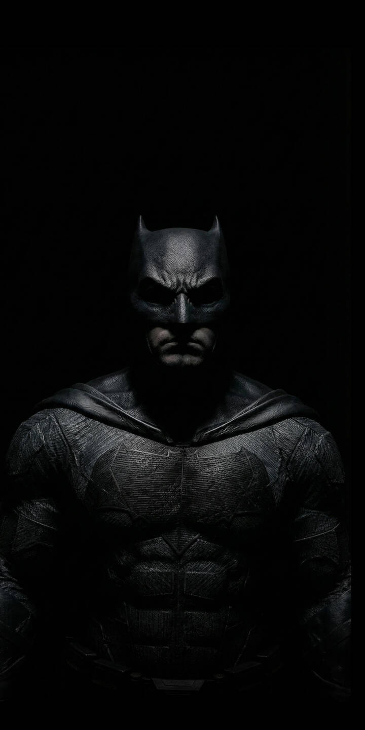 Immerse yourself in the dark world of Gotham with this striking Batman 4K wallpaper, featuring the Caped Crusader's formidable armored suit and brooding expression against a stark black background. This stunning wallpaper is perfect for personalizing your iPhone, showcasing the iconic bat symbol faintly visible on his chest. | superhero batman iphone dark knight mobile justice league 4k wallpaper hd wallpaper bruce wayne black aesthetic dc comics comic hero Immerse yourself in the dark world of Gotham with this striking Batman 4K wallpaper, featuring the Caped Crusader's formidable armored suit and brooding expression against a stark black background. This stunning wallpaper is perfect for personalizing your iPhone, showcasing the iconic bat symbol faintly visible on his chest.