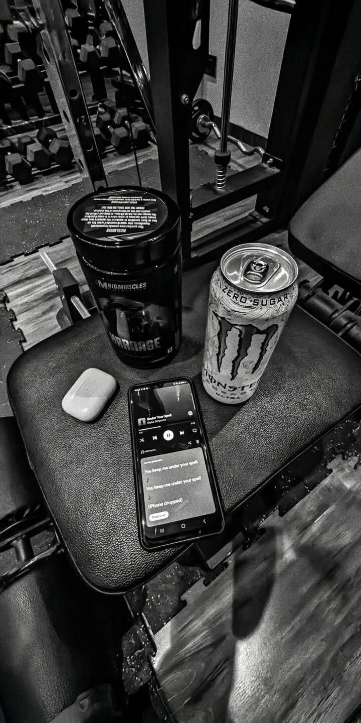 Elevate your screen with this striking monochrome gym essentials 4K wallpaper, featuring a Monster energy drink, phone playing music, and AirPods case on a gym bench. This detailed wallpaper is perfect for your iPhone, showcasing a focused workout setup. | iphone mobile 4k wallpaper hd wallpaper monochrome monster energy fitness motivation workout airpods gym essentials gym bench pre workout Elevate your screen with this striking monochrome gym essentials 4K wallpaper, featuring a Monster energy drink, phone playing music, and AirPods case on a gym bench. This detailed wallpaper is perfect for your iPhone, showcasing a focused workout setup.