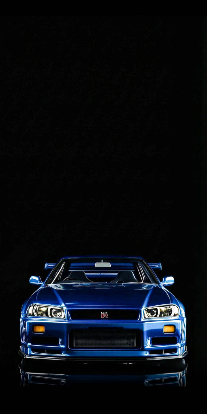 Adorn your iPhone with this stunning Nissan GT-R R34 4K wallpaper, featuring the iconic blue sports car dramatically presented against a deep black background. The sleek front view highlights its distinctive headlights and the famous GT-R badge, making it a perfect high-definition wallpaper for car enthusiasts. | sports car iphone nissan skyline mobile gtr r34 blue car 4k wallpaper hd wallpaper automotive jdm nissan gtr r34 skyline r34 Adorn your iPhone with this stunning Nissan GT-R R34 4K wallpaper, featuring the iconic blue sports car dramatically presented against a deep black background. The sleek front view highlights its distinctive headlights and the famous GT-R badge, making it a perfect high-definition wallpaper for car enthusiasts.