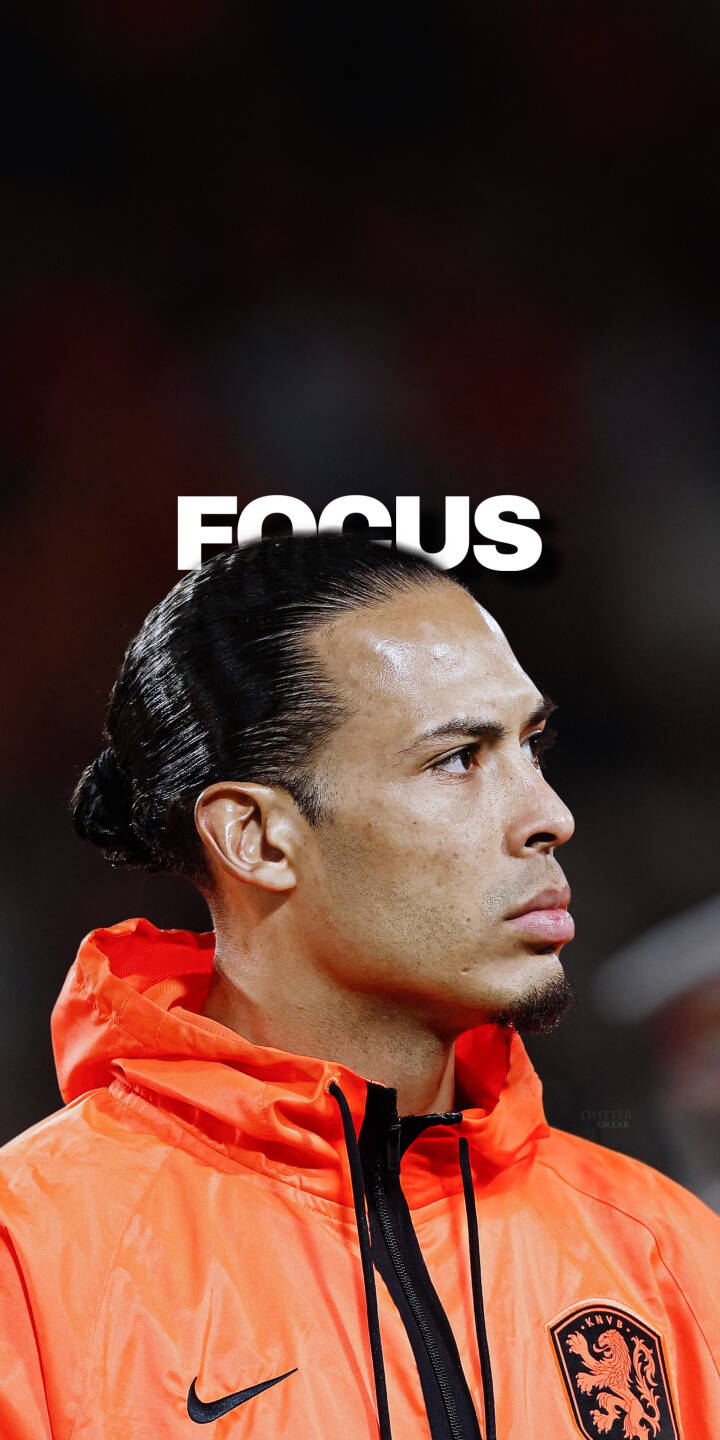 Elevate your iPhone with this stunning Virgil van Dijk 4K wallpaper, capturing the intense focus of the Dutch defender. This striking wallpaper features Van Dijk with his signature man bun, wearing his vibrant orange national team jacket, and prominently displaying the word "FOCUS". | football defender focus iphone soccer virgil van dijk mobile 4k wallpaper hd wallpaper orange kit vvd netherlands Elevate your iPhone with this stunning Virgil van Dijk 4K wallpaper, capturing the intense focus of the Dutch defender. This striking wallpaper features Van Dijk with his signature man bun, wearing his vibrant orange national team jacket, and prominently displaying the word "FOCUS".