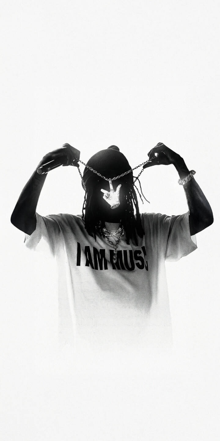 Lil Wayne's signature glowing hand sign pendant illuminates his face in this striking black and white 4K wallpaper, featuring his iconic 'I AM MUSIC' t-shirt. This must-have wallpaper for iPhone captures the rapper's legendary presence perfectly. | rapper music iphone wallpaper black and white hip hop mobile 4k wallpaper hd wallpaper lil wayne weezy Lil Wayne's signature glowing hand sign pendant illuminates his face in this striking black and white 4K wallpaper, featuring his iconic 'I AM MUSIC' t-shirt. This must-have wallpaper for iPhone captures the rapper's legendary presence perfectly.