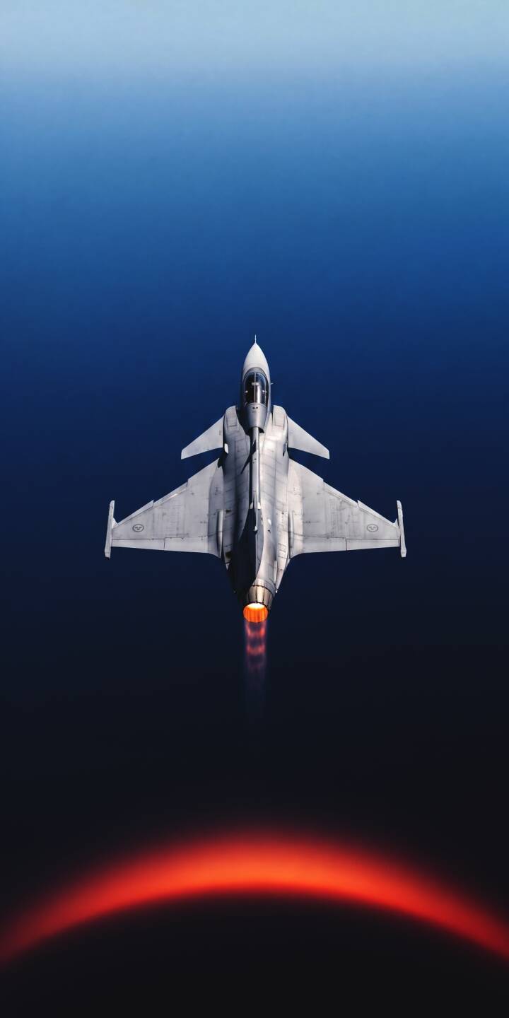 An intense orange afterburner streaks from the powerful JAS 39 Gripen fighter jet as it soars through a dark atmospheric gradient in this stunning 4K wallpaper. This dynamic aerospace wallpaper is perfect for personalizing your iPhone. | jet iphone fighter jet wallpaper mobile 4k wallpaper hd wallpaper military aviation afterburner jas 39 gripen gripen An intense orange afterburner streaks from the powerful JAS 39 Gripen fighter jet as it soars through a dark atmospheric gradient in this stunning 4K wallpaper. This dynamic aerospace wallpaper is perfect for personalizing your iPhone.
