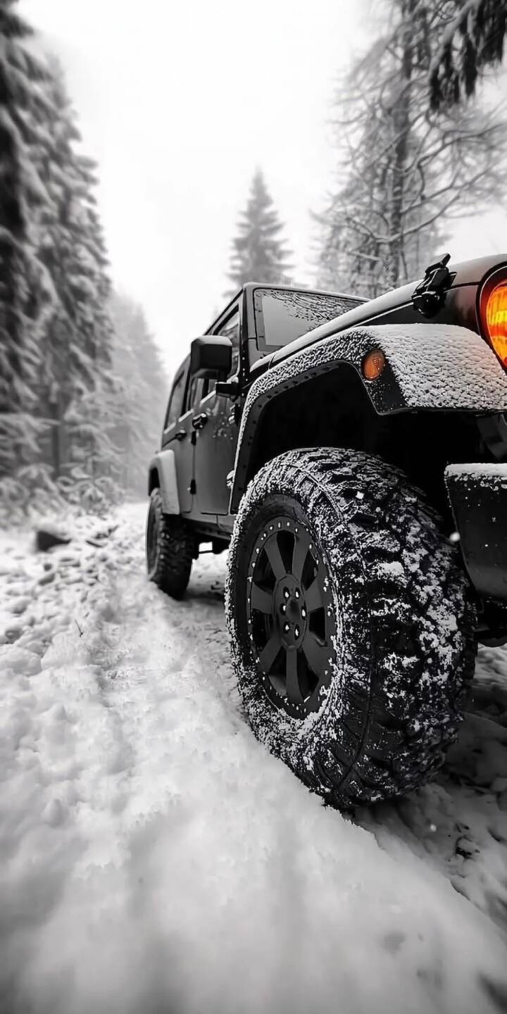 Rugged, snow-covered tires dig into fresh powder as a dark Jeep navigates a silent winter trail, creating an epic 4K wallpaper perfect for iPhone. This immersive off-road wallpaper captures the vehicle's sturdy presence amidst the frosted pine trees and dimly lit orange headlight. | forest jeep snow winter iphone wallpaper mobile 4k wallpaper hd wallpaper automotive offroad wrangler Rugged, snow-covered tires dig into fresh powder as a dark Jeep navigates a silent winter trail, creating an epic 4K wallpaper perfect for iPhone. This immersive off-road wallpaper captures the vehicle's sturdy presence amidst the frosted pine trees and dimly lit orange headlight.