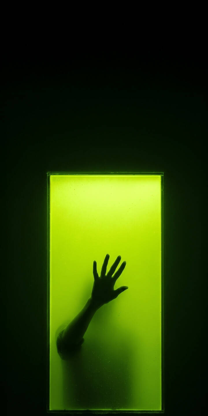 An eerie green glow illuminates a shadowy hand pressed against a luminous panel, creating a haunting 4K wallpaper that's perfect for your iPhone. This mysterious wallpaper captures a sense of the unknown, featuring stark contrast and vibrant neon light. | dark hand green neon iphone wallpaper silhouette mobile glowing 4k wallpaper hd wallpaper eerie An eerie green glow illuminates a shadowy hand pressed against a luminous panel, creating a haunting 4K wallpaper that's perfect for your iPhone. This mysterious wallpaper captures a sense of the unknown, featuring stark contrast and vibrant neon light.