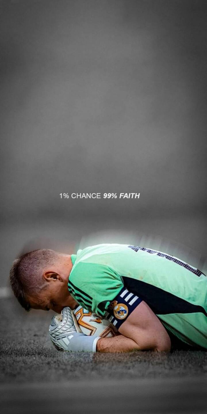 A dedicated goalkeeper intimately cradles and kisses the football, emphasizing the profound '1% CHANCE 99% FAITH' quote in this inspiring 4K wallpaper, perfect as a motivational wallpaper for iPhone fans. | sports football quote goalkeeper motivation iphone soccer wallpaper mobile faith 4k wallpaper hd wallpaper inspirational A dedicated goalkeeper intimately cradles and kisses the football, emphasizing the profound '1% CHANCE 99% FAITH' quote in this inspiring 4K wallpaper, perfect as a motivational wallpaper for iPhone fans.