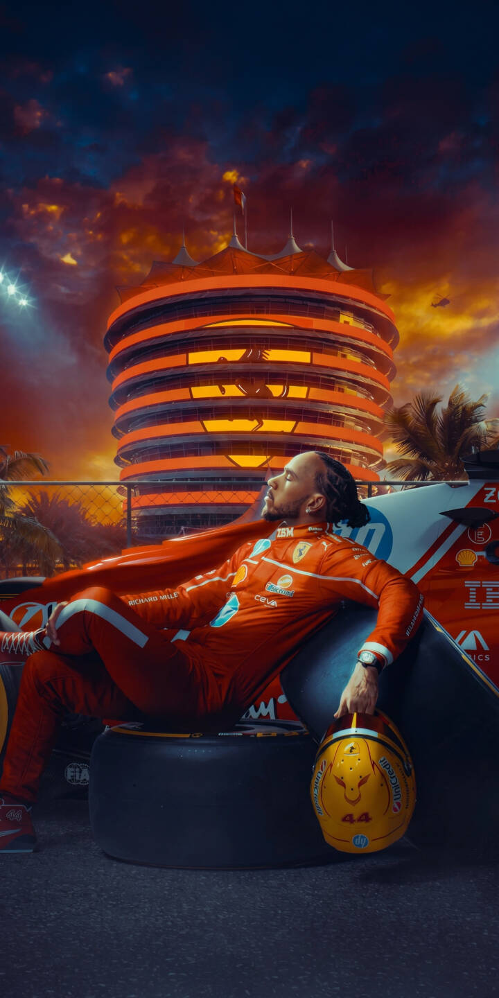 Lewis Hamilton, draped in a vibrant red racing suit, poses confidently with his iconic yellow helmet against a dramatic sunset and the striking architecture of a famous circuit, making this an inspiring 4K wallpaper for iPhone. This intense F1 wallpaper captures the legendary driver's commanding presence, perfect for your mobile device. | iphone ferrari wallpaper f1 lewis hamilton formula 1 mobile 4k wallpaper hd wallpaper dramatic race car driver bahrain Lewis Hamilton, draped in a vibrant red racing suit, poses confidently with his iconic yellow helmet against a dramatic sunset and the striking architecture of a famous circuit, making this an inspiring 4K wallpaper for iPhone. This intense F1 wallpaper captures the legendary driver's commanding presence, perfect for your mobile device.