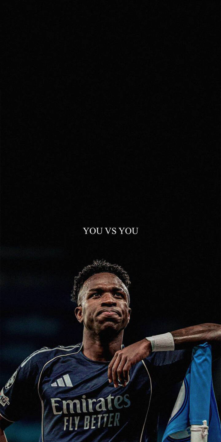 The powerful 'YOU VS YOU' motto hovers above Vinicius Jr's determined gaze in this inspiring 4K wallpaper, featuring his dark blue Real Madrid jersey for iPhone users. This unique wallpaper captures Vini Jr's focused intensity. | football aesthetic motivation iphone real madrid wallpaper vinicius jr mobile 4k wallpaper hd wallpaper vini jr The powerful 'YOU VS YOU' motto hovers above Vinicius Jr's determined gaze in this inspiring 4K wallpaper, featuring his dark blue Real Madrid jersey for iPhone users. This unique wallpaper captures Vini Jr's focused intensity.
