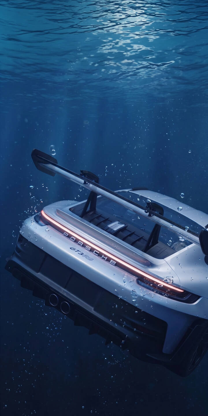 The iconic white Porsche GT3 RS is breathtakingly submerged in deep blue water, its taillights glowing softly as bubbles drift upwards in this striking 4K wallpaper. This stunning automotive wallpaper is perfect for personalizing your iPhone. | aesthetic car sports car underwater iphone porsche wallpaper mobile gt3 rs 4k wallpaper hd wallpaper automotive The iconic white Porsche GT3 RS is breathtakingly submerged in deep blue water, its taillights glowing softly as bubbles drift upwards in this striking 4K wallpaper. This stunning automotive wallpaper is perfect for personalizing your iPhone.