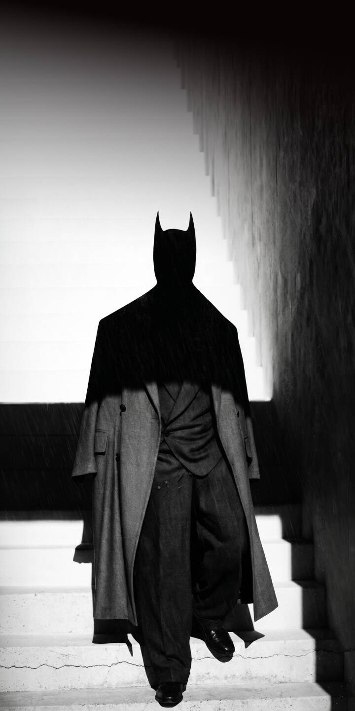 The dark silhouette of Batman in a stylish trench coat descends a stark monochrome staircase in this captivating 4K wallpaper, making it a mysteriously elegant background for your iPhone. | batman trench coat iphone minimalist wallpaper mobile 4k wallpaper hd wallpaper bruce wayne dark aesthetic monochrome dc comics The dark silhouette of Batman in a stylish trench coat descends a stark monochrome staircase in this captivating 4K wallpaper, making it a mysteriously elegant background for your iPhone.