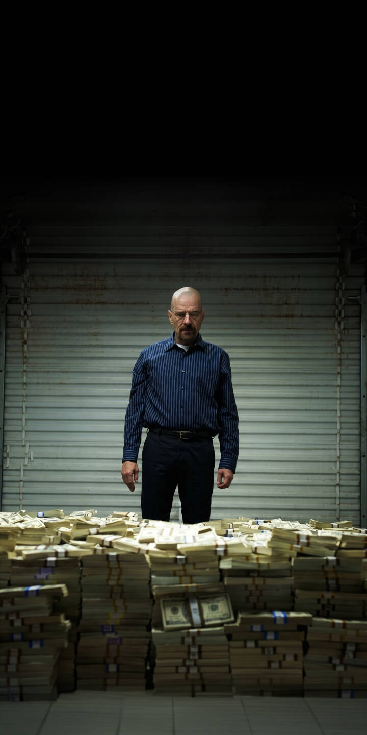 A grim-faced Walter White stands defiantly behind a colossal hoard of meticulously stacked cash, portraying his immense power in this striking 4K wallpaper. This intense visual makes an impactful iPhone wallpaper for fans of Breaking Bad. | cash money crime iphone breaking bad walter white wallpaper heisenberg mobile 4k wallpaper hd wallpaper dark aesthetic A grim-faced Walter White stands defiantly behind a colossal hoard of meticulously stacked cash, portraying his immense power in this striking 4K wallpaper. This intense visual makes an impactful iPhone wallpaper for fans of Breaking Bad.