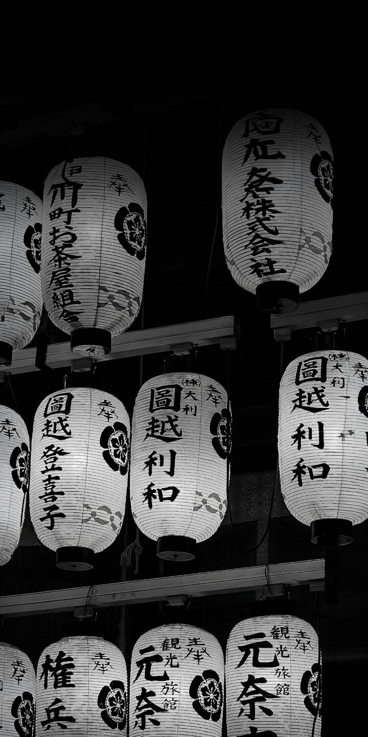 Glowing softly against a dark background, white Japanese lanterns adorned with intricate black calligraphy and traditional crests create a serene and striking 4K wallpaper. This elegant monochromatic wallpaper is perfect for personalizing your iPhone. | traditional iphone wallpaper black and white mobile 4k wallpaper hd wallpaper monochrome calligraphy asian aesthetic japanese lanterns paper lanterns Glowing softly against a dark background, white Japanese lanterns adorned with intricate black calligraphy and traditional crests create a serene and striking 4K wallpaper. This elegant monochromatic wallpaper is perfect for personalizing your iPhone.