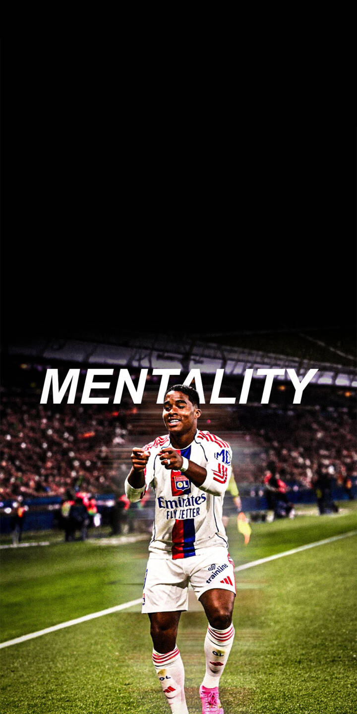 Malo Gusto points triumphantly on the pitch, his bright pink boots adding a pop of color to this electrifying 4K wallpaper that captures a moment of pure football celebration. The bold 'MENTALITY' text crowns this dynamic image, making it an essential wallpaper for iPhone users who admire the spirit of Olympique Lyonnais. | sports football stadium celebration iphone soccer wallpaper mobile 4k wallpaper hd wallpaper lyon malo gusto Malo Gusto points triumphantly on the pitch, his bright pink boots adding a pop of color to this electrifying 4K wallpaper that captures a moment of pure football celebration. The bold 'MENTALITY' text crowns this dynamic image, making it an essential wallpaper for iPhone users who admire the spirit of Olympique Lyonnais.