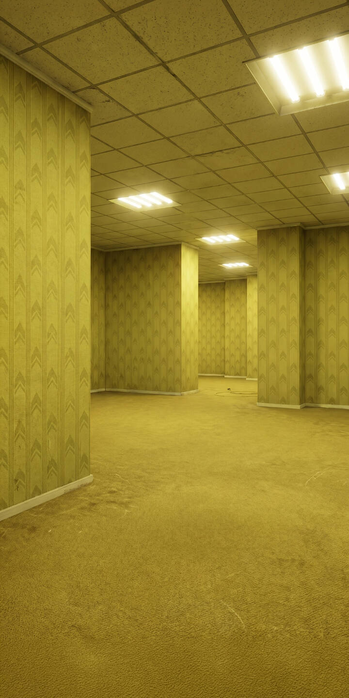 Flickering fluorescent lights illuminate the infinite, empty corridors of The Backrooms in this unsettling 4K wallpaper, a hauntingly immersive wallpaper for iPhone. | creepy iphone wallpaper mobile 4k wallpaper hd wallpaper unsettling yellow aesthetic eerie liminal space backrooms Flickering fluorescent lights illuminate the infinite, empty corridors of The Backrooms in this unsettling 4K wallpaper, a hauntingly immersive wallpaper for iPhone.