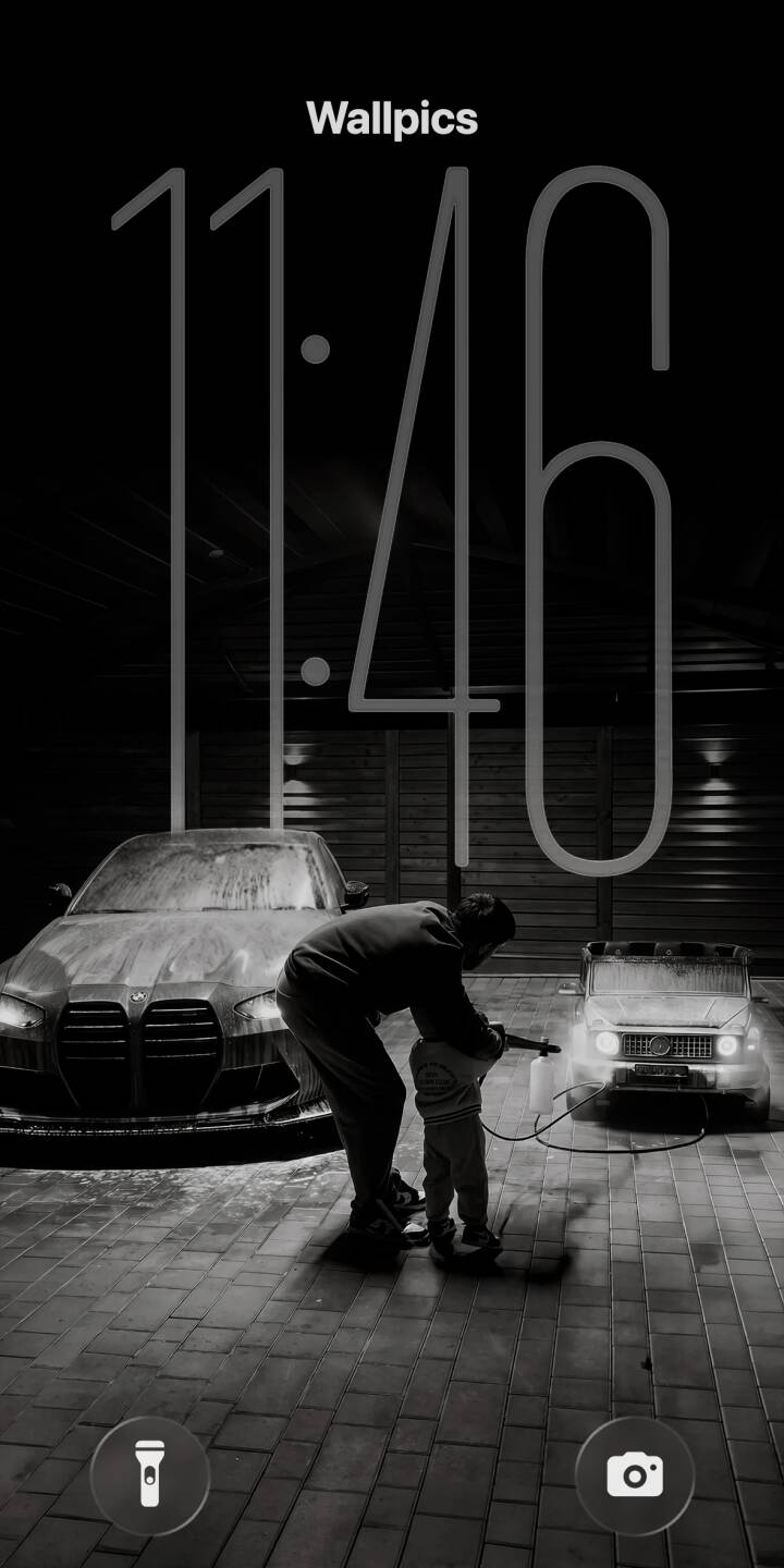 The dramatic grayscale photography captures a heartwarming scene of a father and child washing a suds-covered BMW and a small toy Mercedes G-Wagen. This atmospheric 4K wallpaper beautifully portrays family bonding and the joy of automotive care, perfect as a stylish dark wallpaper for your iPhone. | car child car wash iphone bmw wallpaper grayscale mobile 4k wallpaper hd wallpaper father g-wagen The dramatic grayscale photography captures a heartwarming scene of a father and child washing a suds-covered BMW and a small toy Mercedes G-Wagen. This atmospheric 4K wallpaper beautifully portrays family bonding and the joy of automotive care, perfect as a stylish dark wallpaper for your iPhone.