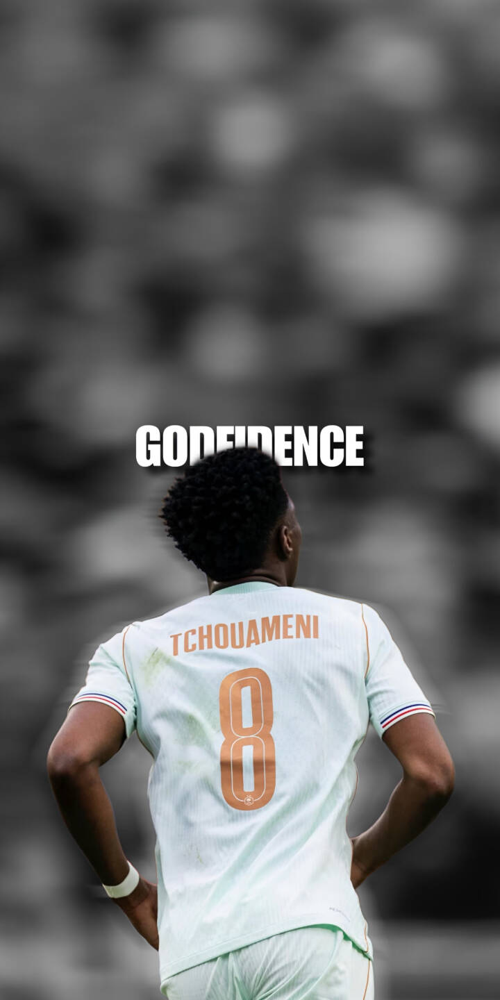 The powerful 'GODFIDENCE' text prominently hovers above Aurélien Tchouaméni, who is captured from behind showcasing his number 8 jersey against a blurred grayscale stadium backdrop in this striking 4K wallpaper. This inspirational football wallpaper for iPhone perfectly captures his confident stance. | sports football iphone soccer wallpaper mobile aurelien tchouameni 4k wallpaper hd wallpaper tchouameni godfidence The powerful 'GODFIDENCE' text prominently hovers above Aurélien Tchouaméni, who is captured from behind showcasing his number 8 jersey against a blurred grayscale stadium backdrop in this striking 4K wallpaper. This inspirational football wallpaper for iPhone perfectly captures his confident stance.