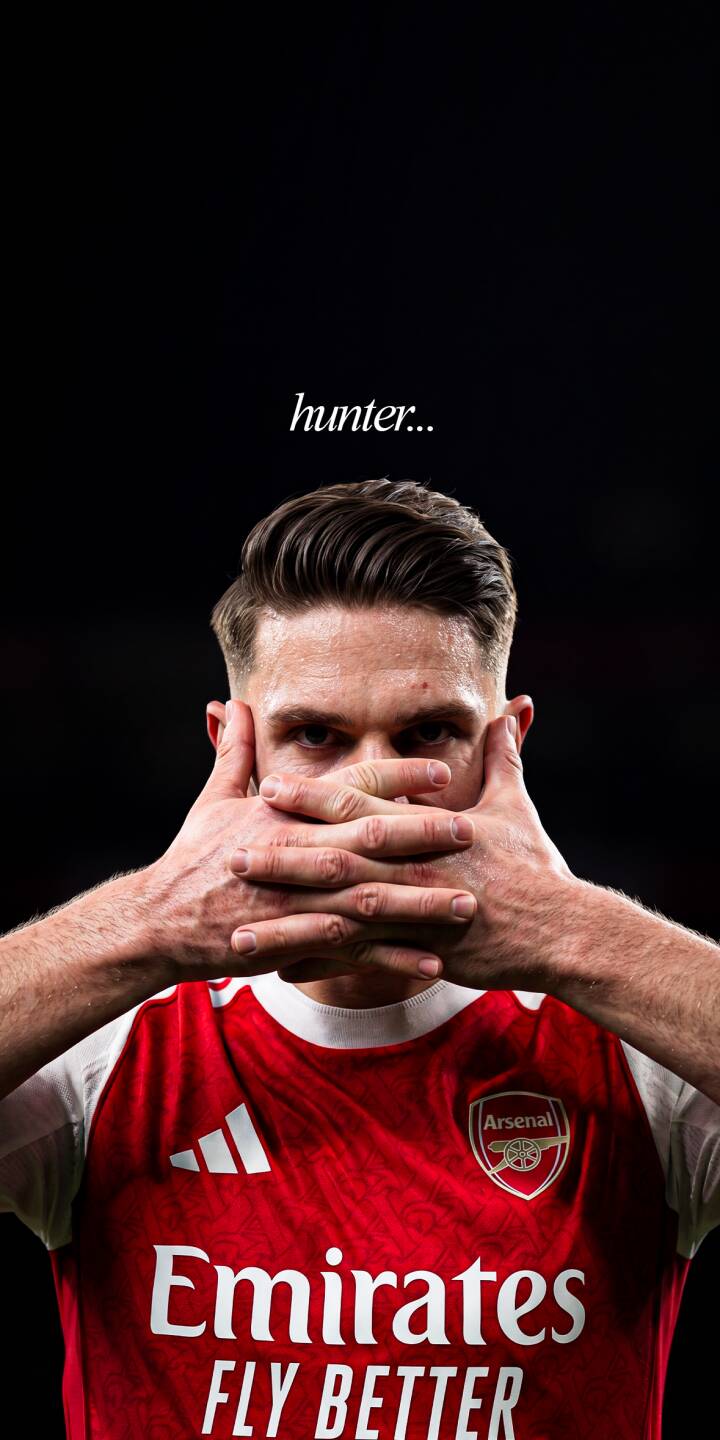 The player's intense gaze pierces from above his hands covering his mouth, with the enigmatic 'hunter...' text hovering above in this striking 4K wallpaper. This captivating Arsenal-themed wallpaper is a must-have for any iPhone user seeking a powerful and mysterious display. | sports football dark player iphone wallpaper mobile hunter arsenal 4k wallpaper hd wallpaper intense The player's intense gaze pierces from above his hands covering his mouth, with the enigmatic 'hunter...' text hovering above in this striking 4K wallpaper. This captivating Arsenal-themed wallpaper is a must-have for any iPhone user seeking a powerful and mysterious display.