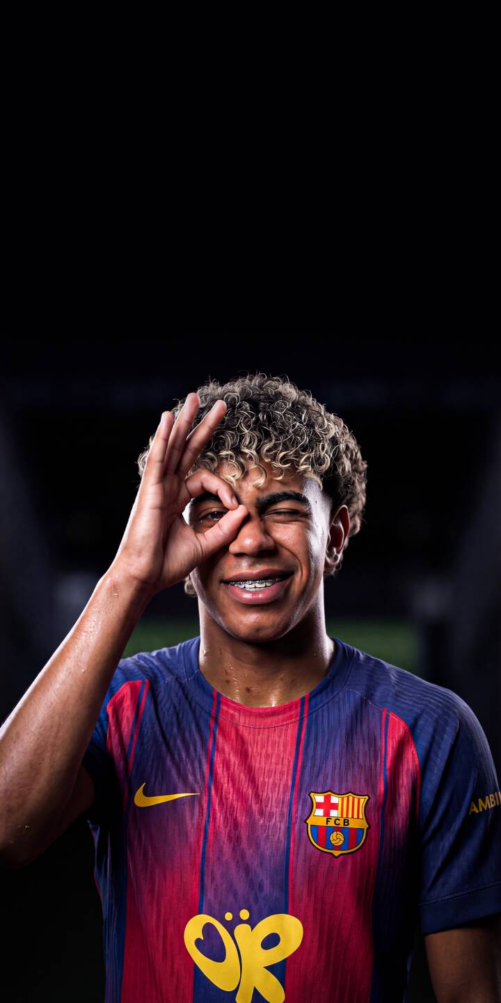 A young FC Barcelona player beams with a confident wink, making an 'OK' gesture over his eye, in this vibrant 4K wallpaper. His curly blonde hair and visible braces add to the playful charm, creating an energetic wallpaper perfect for iPhone. | football player iphone soccer wallpaper barca fc barcelona mobile 4k wallpaper hd wallpaper winking playful A young FC Barcelona player beams with a confident wink, making an 'OK' gesture over his eye, in this vibrant 4K wallpaper. His curly blonde hair and visible braces add to the playful charm, creating an energetic wallpaper perfect for iPhone.