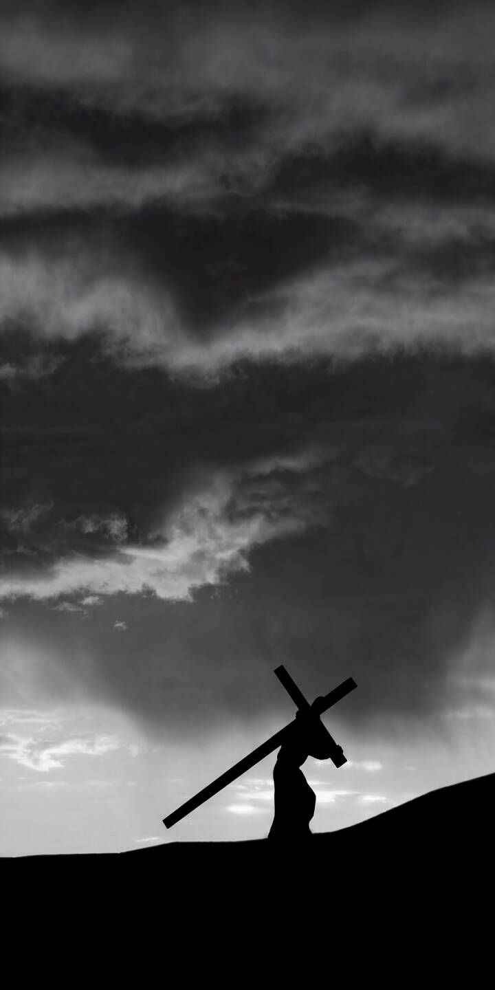 The stark silhouette of a figure carrying a heavy cross against a dramatic, cloud-filled sky creates a powerful 4K wallpaper. This evocative, monochrome scene is a profound wallpaper for iPhone users seeking a reflective background. | cross religious iphone wallpaper silhouette jesus mobile 4k wallpaper hd wallpaper monochrome christ dramatic The stark silhouette of a figure carrying a heavy cross against a dramatic, cloud-filled sky creates a powerful 4K wallpaper. This evocative, monochrome scene is a profound wallpaper for iPhone users seeking a reflective background.