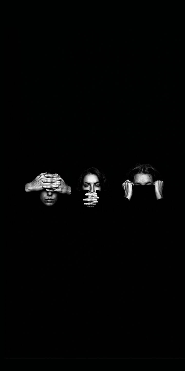 Against a stark, deep black background, three grayscale faces dramatically illustrate the 'see no evil, speak no evil, hear no evil' philosophy in this compelling 4K wallpaper, making it an introspective wallpaper for iPhone. Each figure's hands are strategically placed over their eyes, mouth, and ears, creating a powerful visual message. | iphone minimalist wallpaper black and white mobile 4k wallpaper hd wallpaper dark aesthetic three wise monkeys see no evil speak no evil hear no evil Against a stark, deep black background, three grayscale faces dramatically illustrate the 'see no evil, speak no evil, hear no evil' philosophy in this compelling 4K wallpaper, making it an introspective wallpaper for iPhone. Each figure's hands are strategically placed over their eyes, mouth, and ears, creating a powerful visual message.
