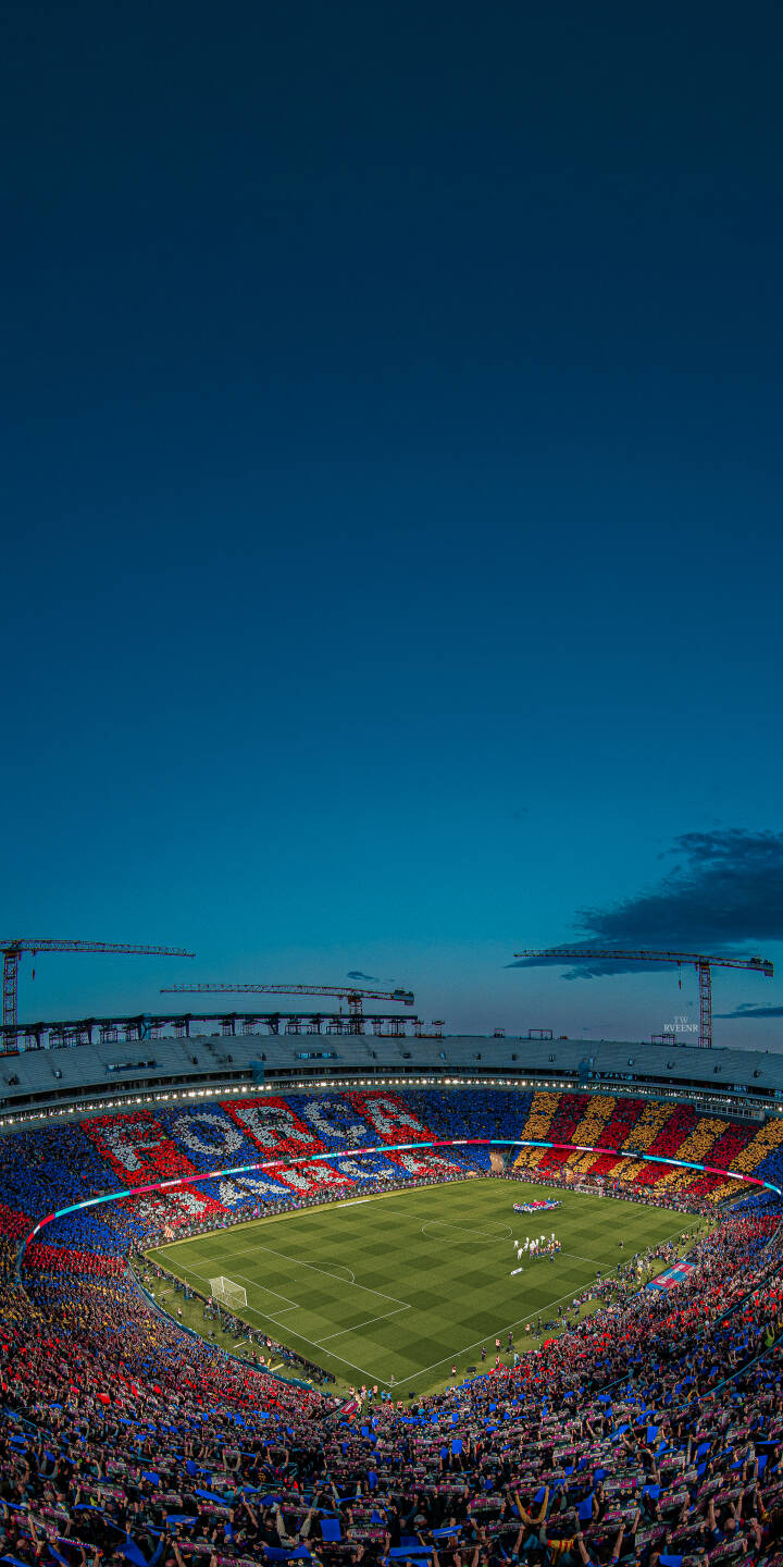 The iconic "FORÇA BARÇA" mosaic glows brightly amidst a sea of fans at Camp Nou during an atmospheric dusk in this stunning 4K wallpaper. This immersive stadium wallpaper is perfect for any iPhone, capturing the vibrant energy of match night. | sports football stadium crowd iphone wallpaper fc barcelona mobile 4k wallpaper hd wallpaper camp nou evening The iconic "FORÇA BARÇA" mosaic glows brightly amidst a sea of fans at Camp Nou during an atmospheric dusk in this stunning 4K wallpaper. This immersive stadium wallpaper is perfect for any iPhone, capturing the vibrant energy of match night.