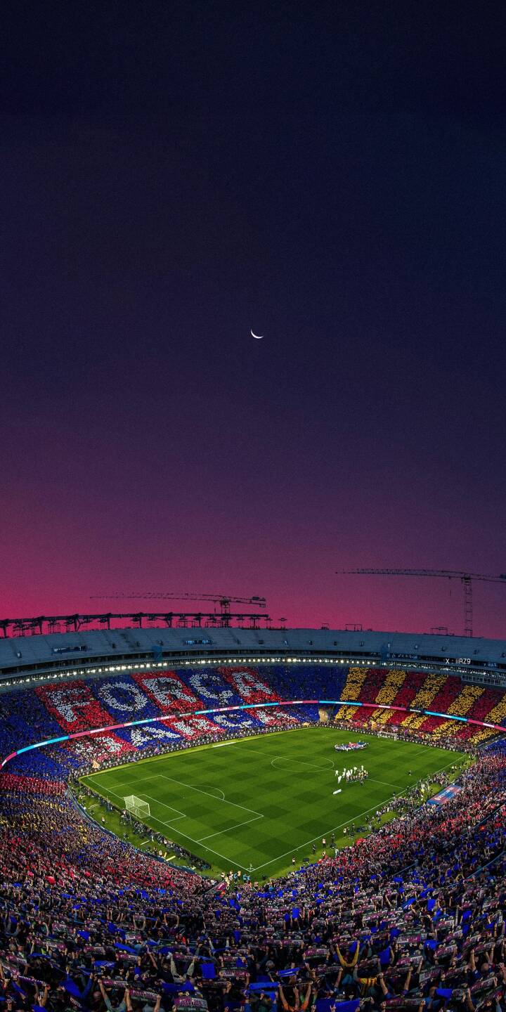 A stunning purple and pink gradient fills the sky above a packed Camp Nou stadium, where a giant 'Força Barça' mosaic electrifies the stands in this breathtaking 4K wallpaper. The crescent moon peeks through the twilight, making this an essential football wallpaper for iPhone. | sports football sunset stadium iphone wallpaper fc barcelona mobile 4k wallpaper hd wallpaper crescent moon camp nou A stunning purple and pink gradient fills the sky above a packed Camp Nou stadium, where a giant 'Força Barça' mosaic electrifies the stands in this breathtaking 4K wallpaper. The crescent moon peeks through the twilight, making this an essential football wallpaper for iPhone.