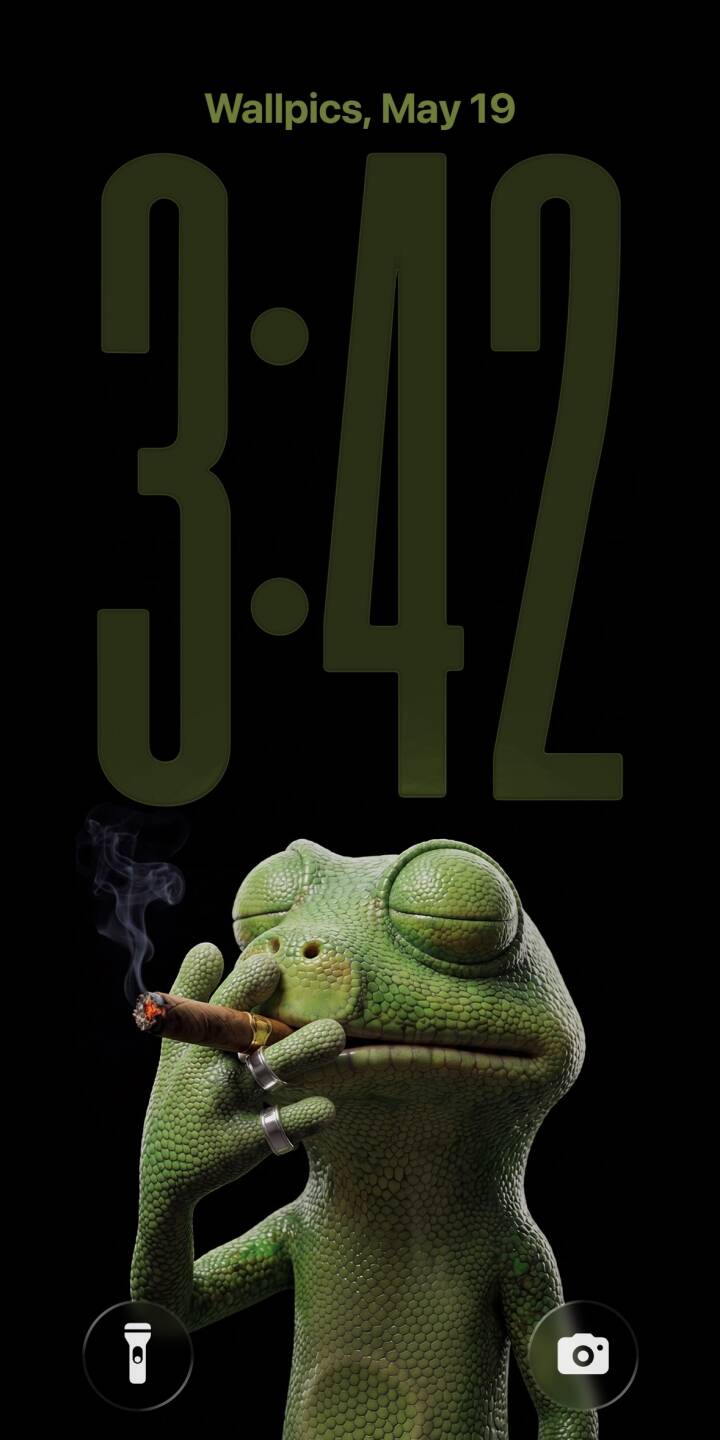 Puffs of smoke curl upward from the lit cigar held by a cool green gecko, whose eyes are blissfully closed as he sports a stylish silver ring in this captivating 4K wallpaper; an ideal iPhone wallpaper for a distinctive look. | lizard smoke cigar iphone realistic wallpaper cool smoking mobile 4k wallpaper hd wallpaper gecko Puffs of smoke curl upward from the lit cigar held by a cool green gecko, whose eyes are blissfully closed as he sports a stylish silver ring in this captivating 4K wallpaper; an ideal iPhone wallpaper for a distinctive look.