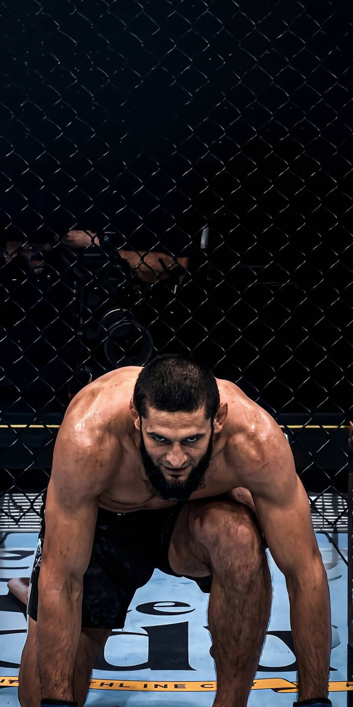 Khamzat Chimaev's intense, focused gaze dominates this powerful 4K wallpaper, showcasing his sweat-glistened muscles and ready-to-strike pose in the octagon – a must-have wallpaper for iPhone fans. | iphone fighter wallpaper mma mobile ufc 4k wallpaper hd wallpaper intense khamzat chimaev borz chimaev Khamzat Chimaev's intense, focused gaze dominates this powerful 4K wallpaper, showcasing his sweat-glistened muscles and ready-to-strike pose in the octagon – a must-have wallpaper for iPhone fans.
