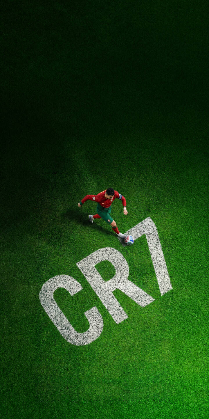 The iconic white 'CR7' logo gleams on the vibrant green pitch as Cristiano Ronaldo skillfully dribbles the football in this dynamic 4K wallpaper. This action-packed wallpaper is a must-have for iPhone fans looking to showcase their passion for soccer. | sports football iphone soccer wallpaper cr7 cristiano ronaldo mobile 4k wallpaper hd wallpaper dribbling green pitch The iconic white 'CR7' logo gleams on the vibrant green pitch as Cristiano Ronaldo skillfully dribbles the football in this dynamic 4K wallpaper. This action-packed wallpaper is a must-have for iPhone fans looking to showcase their passion for soccer.