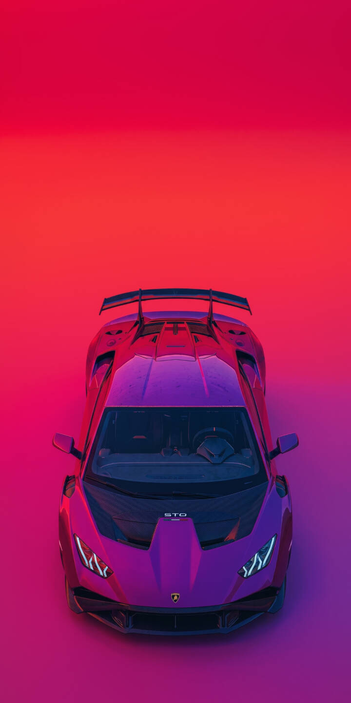 A dazzling purple Lamborghini Huracán STO gleams under vibrant magenta and red lighting from an overhead view in this striking 4K wallpaper. Its massive rear wing and sleek lines are perfect for an energetic iPhone wallpaper experience, making this a standout automotive wallpaper for enthusiasts. | purple iphone lamborghini supercar wallpaper gradient mobile 4k wallpaper hd wallpaper automotive sleek huracan sto A dazzling purple Lamborghini Huracán STO gleams under vibrant magenta and red lighting from an overhead view in this striking 4K wallpaper. Its massive rear wing and sleek lines are perfect for an energetic iPhone wallpaper experience, making this a standout automotive wallpaper for enthusiasts.