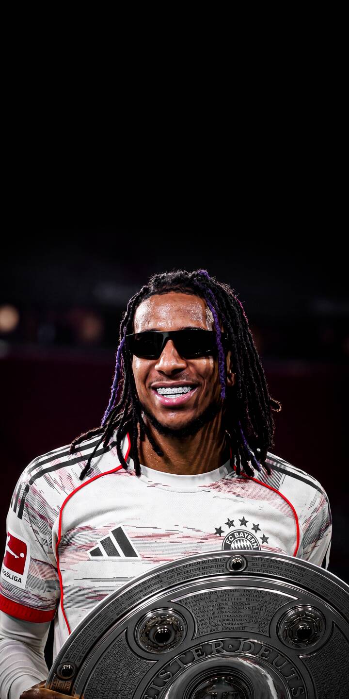 Sleek dark sunglasses and a bright, confident smile define Micha as he proudly displays the Bundesliga Meisterschel Olise ale in this stunning 4K wallpaper, making it an essential football wallpaper for any iPhone. | football sunglasses iphone wallpaper bundesliga champions mobile michael olise 4k wallpaper hd wallpaper olise bayern munich meister Sleek dark sunglasses and a bright, confident smile define Micha as he proudly displays the Bundesliga Meisterschel Olise ale in this stunning 4K wallpaper, making it an essential football wallpaper for any iPhone.