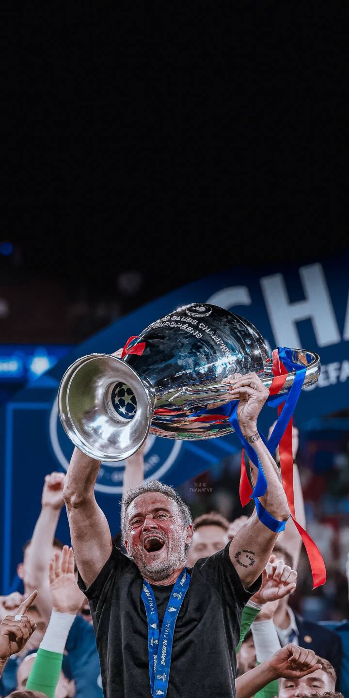 An ecstatic champion, face streaked with celebratory red paint, raises the gleaming UEFA Champions League trophy high in this vibrant 4K wallpaper. This dynamic wallpaper for iPhone captures the pure elation of victory. | sports football trophy celebration iphone wallpaper mobile 4k wallpaper hd wallpaper epic champions league victory An ecstatic champion, face streaked with celebratory red paint, raises the gleaming UEFA Champions League trophy high in this vibrant 4K wallpaper. This dynamic wallpaper for iPhone captures the pure elation of victory.