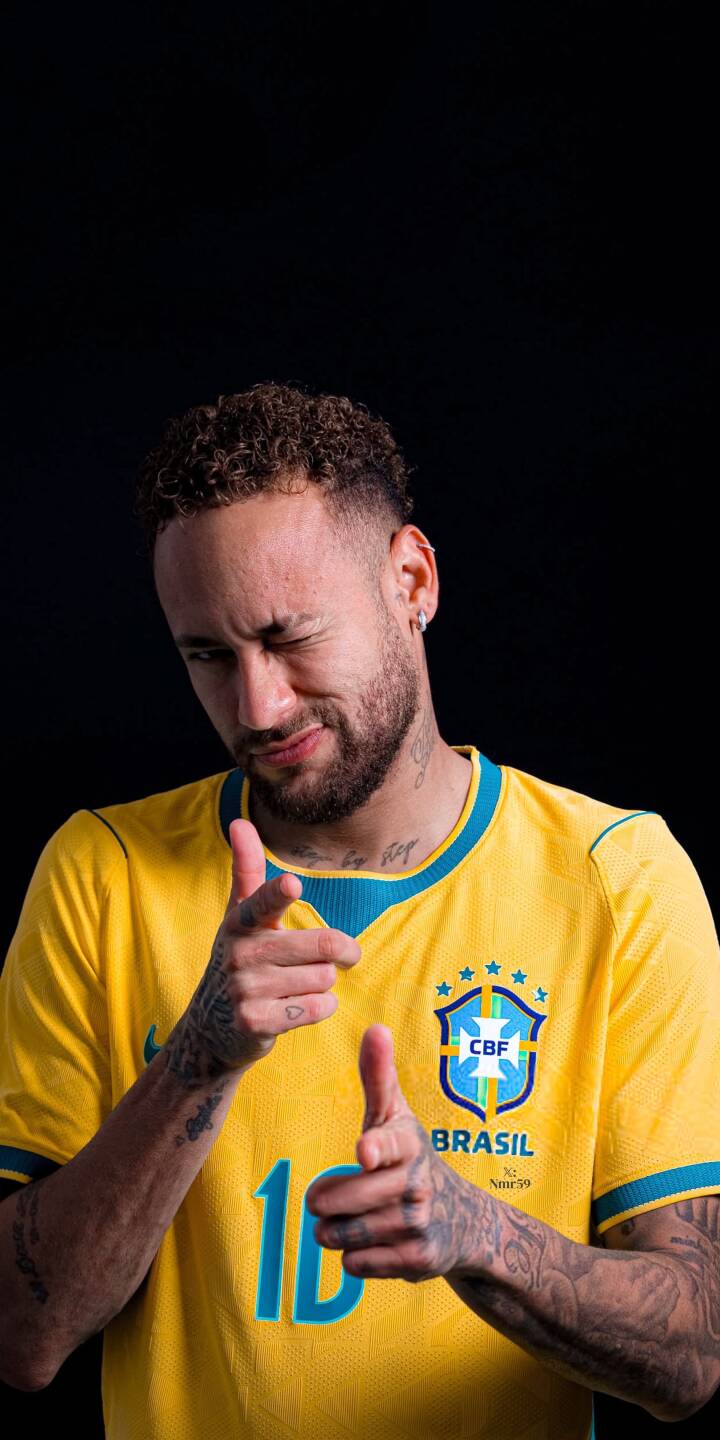 Neymar winks playfully, making a finger gun gesture, while wearing his iconic yellow Brazil jersey in this stunning 4K wallpaper. This dynamic wallpaper is perfect for iPhone users who admire the legendary footballer's charisma. | sports football athlete iphone soccer wallpaper neymar mobile 4k wallpaper hd wallpaper neymar jr brazil jersey Neymar winks playfully, making a finger gun gesture, while wearing his iconic yellow Brazil jersey in this stunning 4K wallpaper. This dynamic wallpaper is perfect for iPhone users who admire the legendary footballer's charisma.