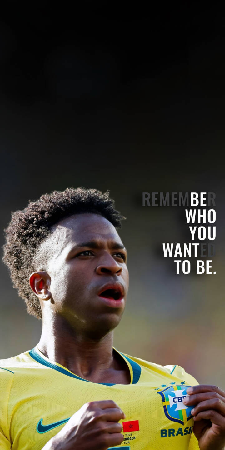 Dressed in his vibrant yellow Brazil jersey, Vinicius Jr's focused gaze looks beyond, accompanied by the powerful text 'REMEMBER WHO YOU WANTED TO BE' in this stunning 4K wallpaper. This inspiring wallpaper for iPhone fans perfectly captures ambition and athletic spirit. | sports football athlete motivation iphone wallpaper brazil vinicius jr mobile 4k wallpaper hd wallpaper inspirational Dressed in his vibrant yellow Brazil jersey, Vinicius Jr's focused gaze looks beyond, accompanied by the powerful text 'REMEMBER WHO YOU WANTED TO BE' in this stunning 4K wallpaper. This inspiring wallpaper for iPhone fans perfectly captures ambition and athletic spirit.