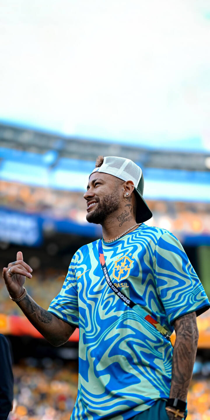 Neymar's vibrant blue and light green swirl jersey stands out in this striking 4K wallpaper, perfectly capturing the Brazilian star's casual smile. Download this dynamic wallpaper for your iPhone to showcase the football icon in style. | sports stadium iphone soccer wallpaper brazil neymar mobile footballer 4k wallpaper hd wallpaper neymar jr Neymar's vibrant blue and light green swirl jersey stands out in this striking 4K wallpaper, perfectly capturing the Brazilian star's casual smile. Download this dynamic wallpaper for your iPhone to showcase the football icon in style.