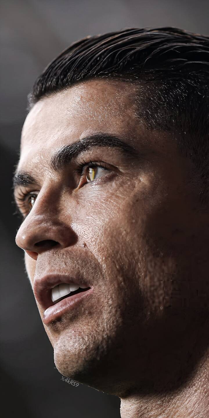 Sweat glistens on Cristiano Ronaldo's brow as he gazes intensely in this detailed 4K wallpaper. This powerful side profile is a perfect wallpaper for any iPhone. | football portrait athlete iphone ronaldo soccer wallpaper cristiano ronaldo mobile 4k wallpaper hd wallpaper sweat Sweat glistens on Cristiano Ronaldo's brow as he gazes intensely in this detailed 4K wallpaper. This powerful side profile is a perfect wallpaper for any iPhone.