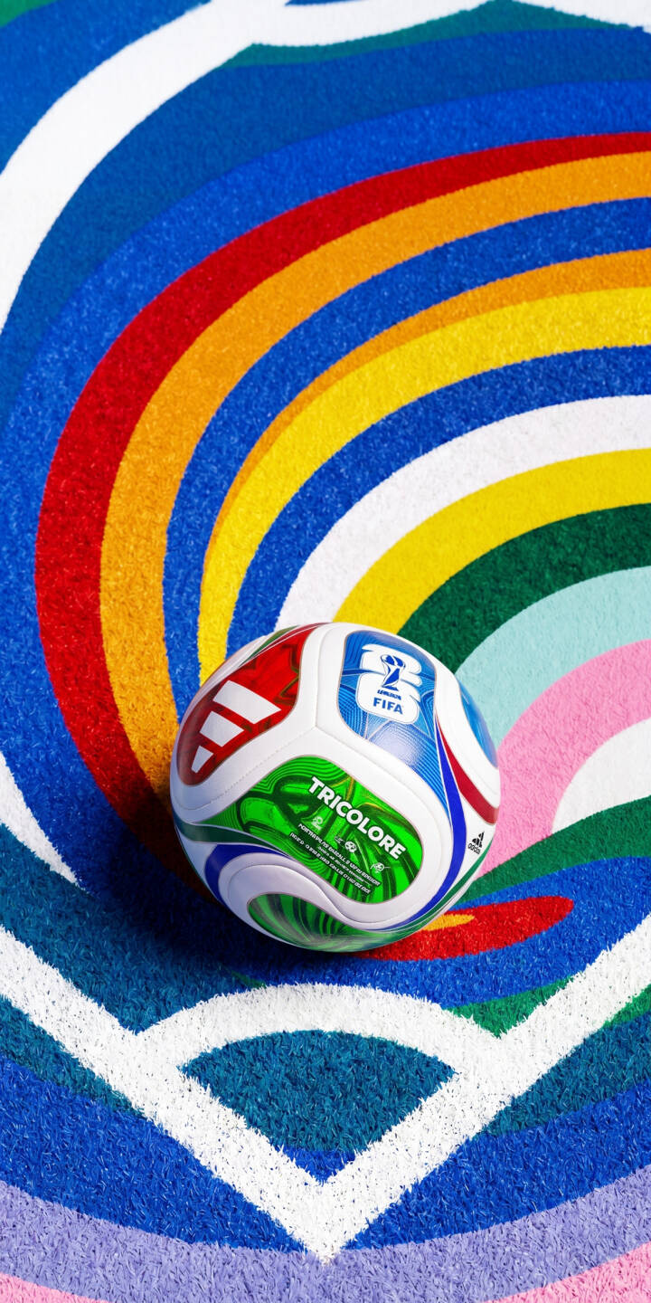 The FIFA World Cup 'Tricolore' Brazuca soccer ball shines brightly against a dazzling backdrop of vibrant, sparkling rainbow arcs, making for an eye-catching 4K wallpaper. This dynamic wallpaper is perfect for any iPhone, capturing the spirit of the beautiful game with its intricate details and rich colors. | sports colorful iphone wallpaper vibrant mobile 4k wallpaper hd wallpaper fifa soccer ball world cup brazuca The FIFA World Cup 'Tricolore' Brazuca soccer ball shines brightly against a dazzling backdrop of vibrant, sparkling rainbow arcs, making for an eye-catching 4K wallpaper. This dynamic wallpaper is perfect for any iPhone, capturing the spirit of the beautiful game with its intricate details and rich colors.