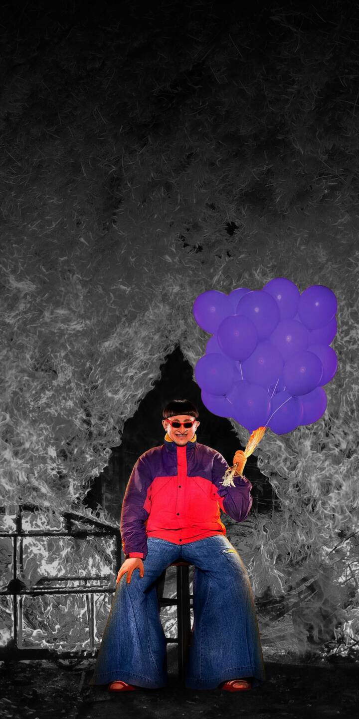 A vibrant bunch of purple balloons pops against the monochromatic, flame-like backdrop where Oliver Tree, sporting his iconic bowl cut and wide-leg jeans, delivers a quirky pose in this stunning 4K wallpaper. This unique wallpaper for iPhone perfectly captures the artist's eccentric style. | aesthetic iphone wallpaper mobile bowl cut 4k wallpaper hd wallpaper chaotic music artist oliver tree purple balloons A vibrant bunch of purple balloons pops against the monochromatic, flame-like backdrop where Oliver Tree, sporting his iconic bowl cut and wide-leg jeans, delivers a quirky pose in this stunning 4K wallpaper. This unique wallpaper for iPhone perfectly captures the artist's eccentric style.