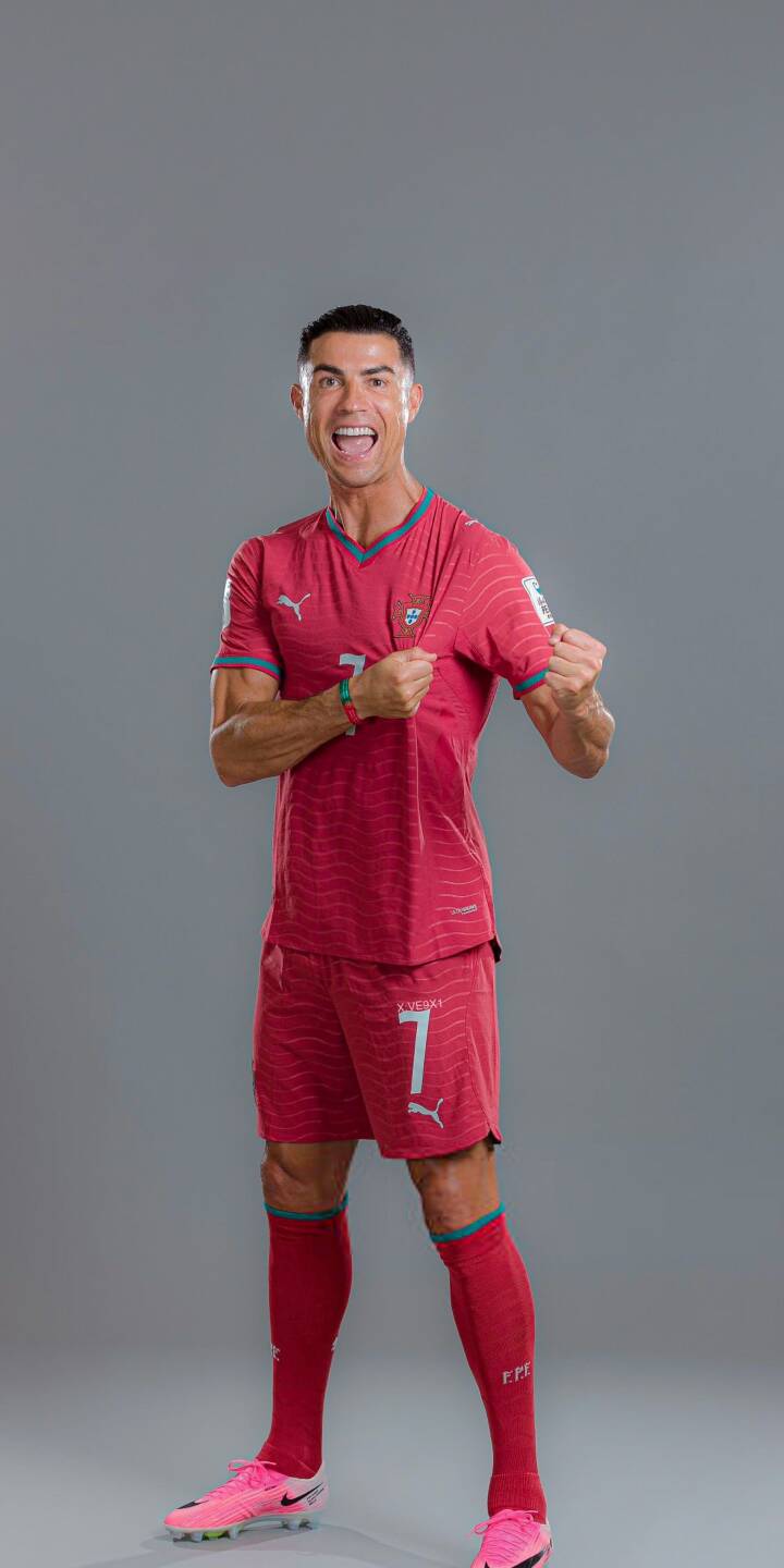 Cristiano Ronaldo flashes a wide, energetic smile while showing off his red jersey and number 7, making for an electrifying 4K wallpaper. This dynamic wallpaper is perfect for any iPhone displaying the legendary footballer. | football athlete iphone ronaldo soccer wallpaper cr7 cristiano ronaldo mobile 4k wallpaper hd wallpaper red kit Cristiano Ronaldo flashes a wide, energetic smile while showing off his red jersey and number 7, making for an electrifying 4K wallpaper. This dynamic wallpaper is perfect for any iPhone displaying the legendary footballer.