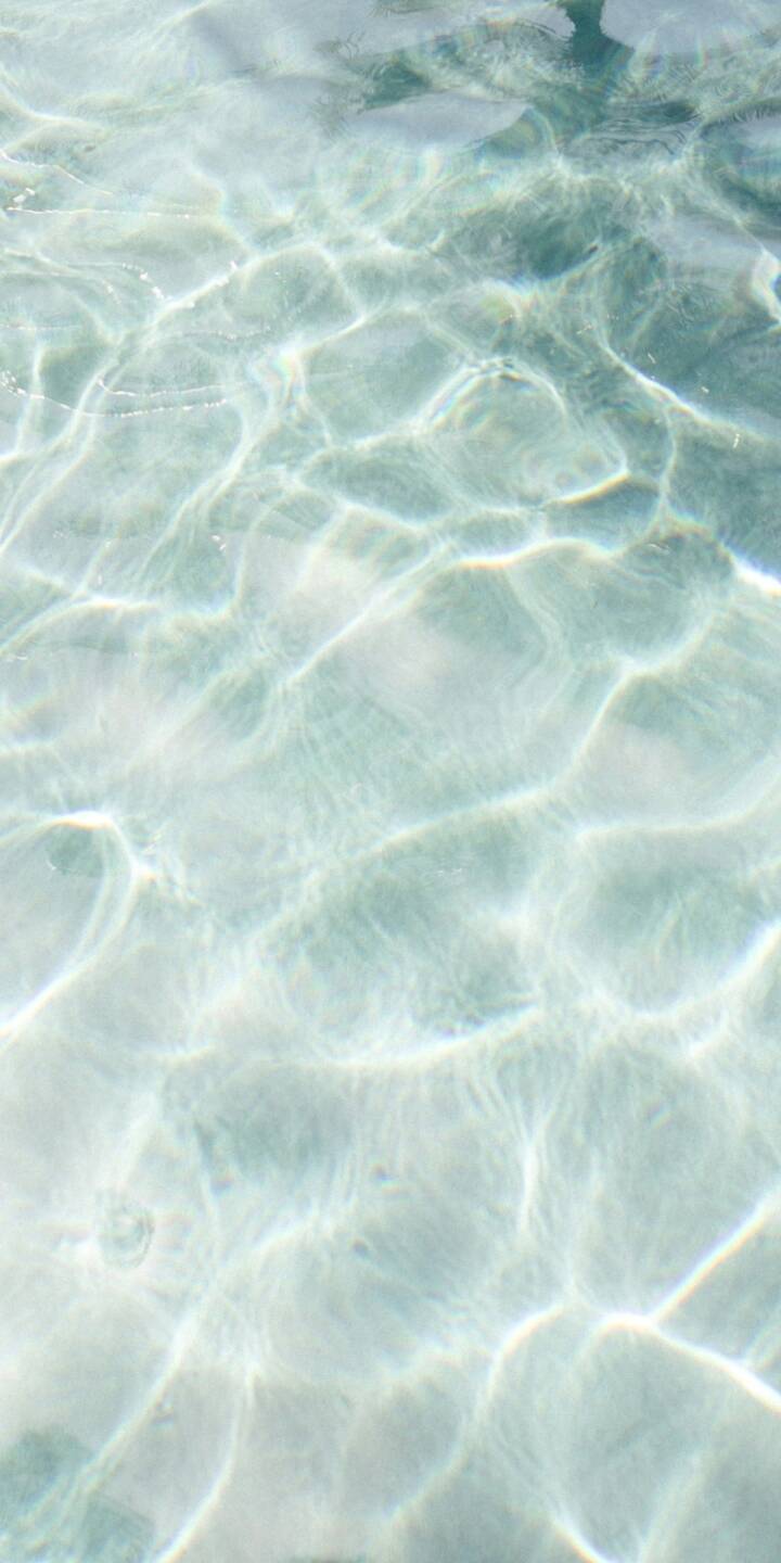 Subtle light patterns shimmer across the surface of tranquil clear water, creating a serene and captivating 4K wallpaper. This refreshing summer wallpaper is a perfect backdrop for your iPhone, bringing a sense of calm to your screen. | aesthetic water light summer iphone wallpaper mobile 4k wallpaper hd wallpaper shimmer serene reflections Subtle light patterns shimmer across the surface of tranquil clear water, creating a serene and captivating 4K wallpaper. This refreshing summer wallpaper is a perfect backdrop for your iPhone, bringing a sense of calm to your screen.