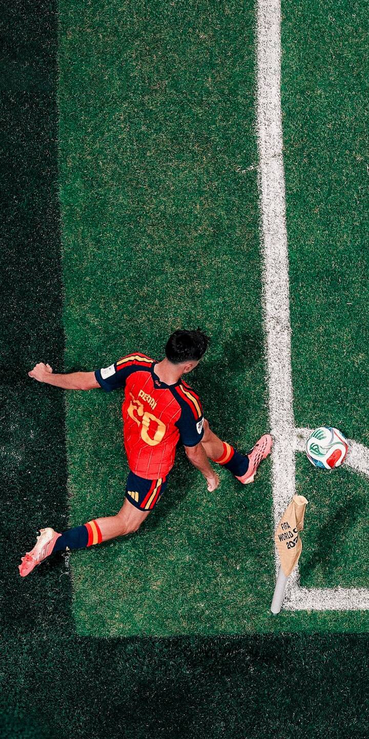 Captured from an overhead perspective, Pedri in his vivid red number 20 jersey executes a powerful kick on the vibrant green pitch, a striking 4K wallpaper for your iPhone. This dynamic football scene makes for an exciting sports wallpaper. | football iphone soccer spain dynamic wallpaper pedri sport action mobile 4k wallpaper hd wallpaper Captured from an overhead perspective, Pedri in his vivid red number 20 jersey executes a powerful kick on the vibrant green pitch, a striking 4K wallpaper for your iPhone. This dynamic football scene makes for an exciting sports wallpaper.