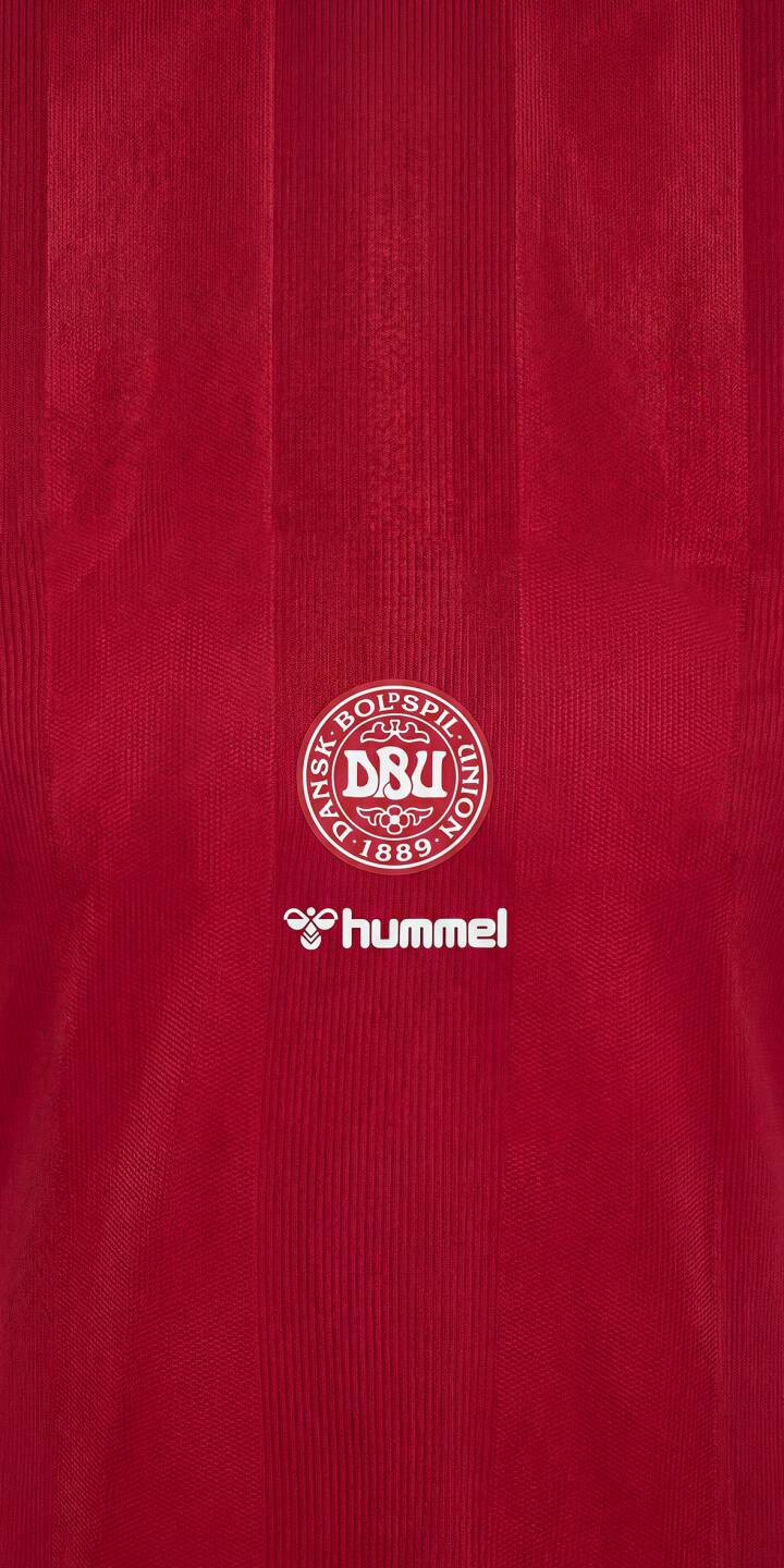 Show your support for Denmark at 2026 with this stunning 4K iPhone wallpaper. Crafted from the official Denmark home kit jersey texture, this wallpaper captures the true spirit of one of the nations competing on the world's biggest stage. Perfect for fans heading into the tournament. | sports football red iphone minimalist soccer wallpaper jersey mobile 4k wallpaper hd wallpaper danish denmark dbu hummel Show your support for Denmark at 2026 with this stunning 4K iPhone wallpaper. Crafted from the official Denmark home kit jersey texture, this wallpaper captures the true spirit of one of the nations competing on the world's biggest stage. Perfect for fans heading into the tournament.