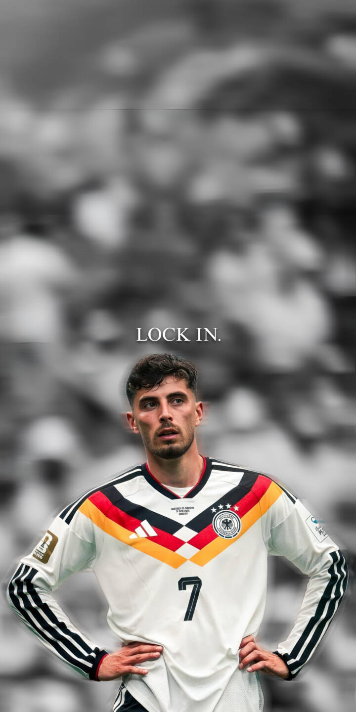 Kai Havertz's intense, focused expression dominates this powerful 4K wallpaper, with the phrase 'LOCK IN.' adding an inspiring touch above him. Displaying the iconic Germany number 7 jersey against a blurred grayscale crowd, this premium wallpaper is perfect for any iPhone to showcase your passion for football. | sports football iphone germany soccer wallpaper mobile lock in 4k wallpaper hd wallpaper kai havertz havertz Kai Havertz's intense, focused expression dominates this powerful 4K wallpaper, with the phrase 'LOCK IN.' adding an inspiring touch above him. Displaying the iconic Germany number 7 jersey against a blurred grayscale crowd, this premium wallpaper is perfect for any iPhone to showcase your passion for football.